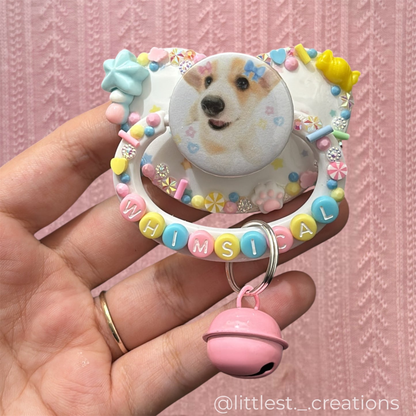 Whimsical image paci with bell